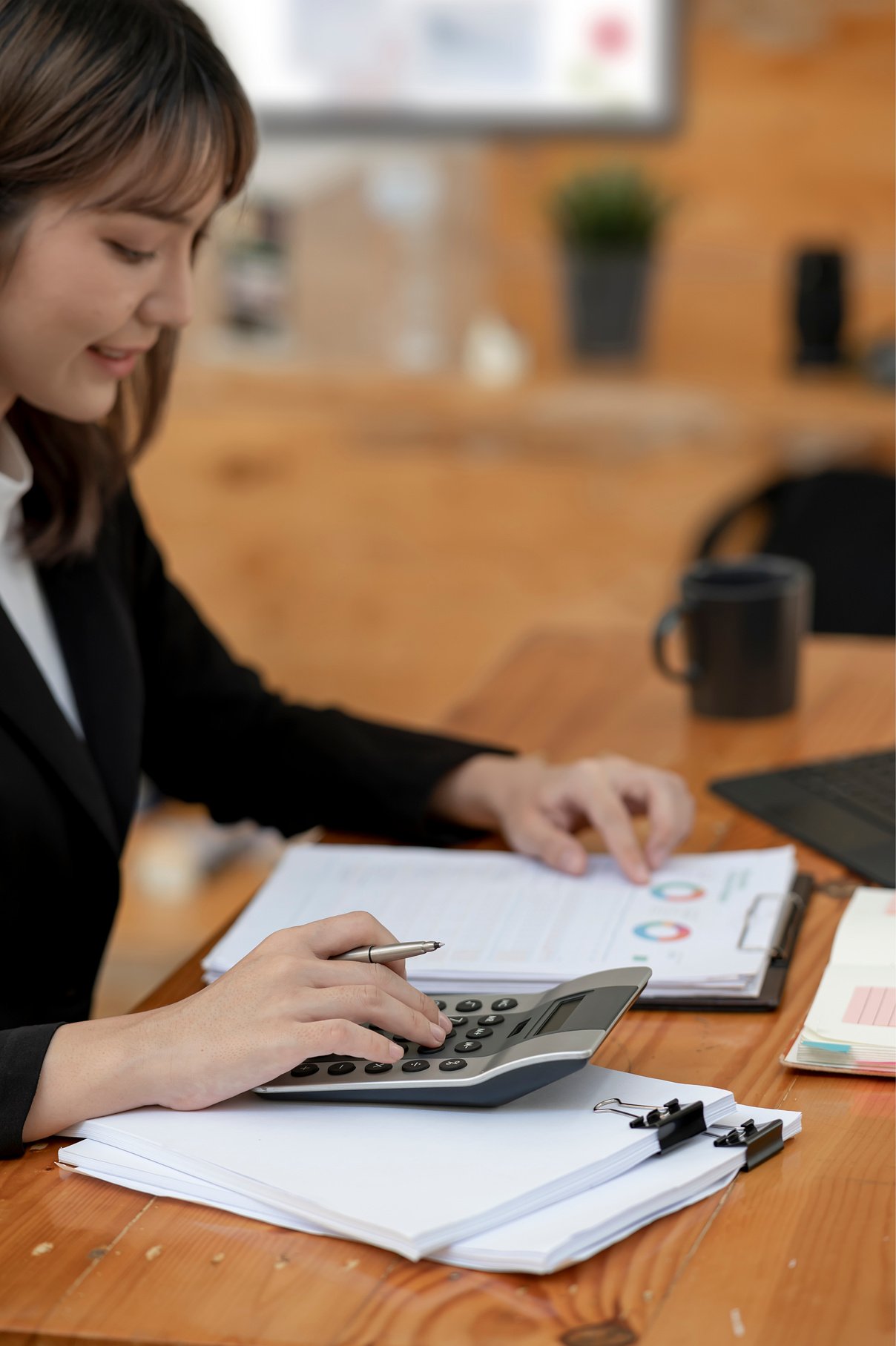 Female accountant calculating graph chart financial 